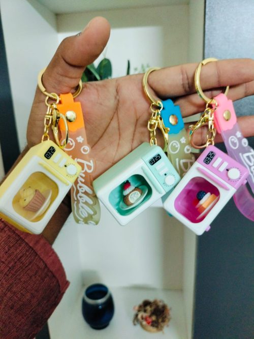 WhatsApp Image 2026-02-21 at 12.21.43 (1) Mini Microwave Oven Keychain with LED Light and Realistic Sound Effects