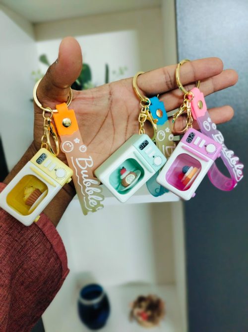 WhatsApp Image 2026-02-21 at 12.21.44 Mini Microwave Oven Keychain with LED Light and Realistic Sound Effects