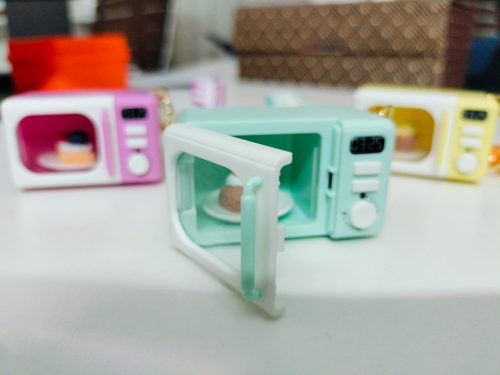 WhatsApp Image 2026-02-21 at 12.21.46 Mini Microwave Oven Keychain with LED Light and Realistic Sound Effects