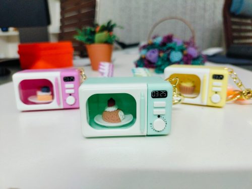WhatsApp Image 2026-02-21 at 12.21.47 Mini Microwave Oven Keychain with LED Light and Realistic Sound Effects